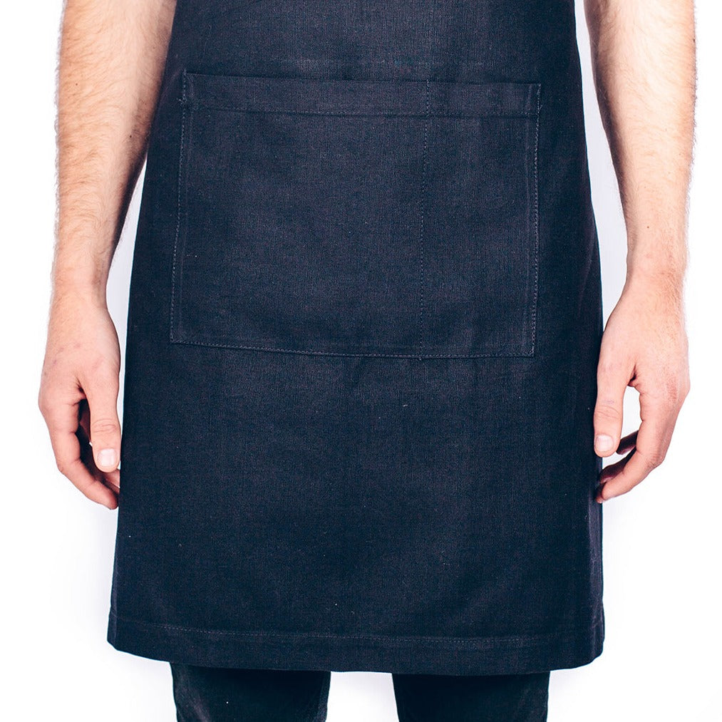 Socially Responsible heavy weight cafe canvas aprons in navy. Available blank or custom printed from Kindred Apparel, Canada.
